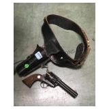 Cast metal toy gun w/ leather belt & holster,