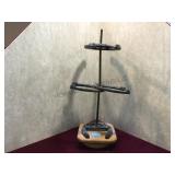 Welded horshoe stand that spins.