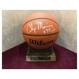 Autographed basketball with stand. (Alonzo