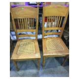 Pair of vintage cane seat high back chairs local