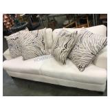 White Jonathan Lewis sofa with cushions and