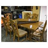 Wooden dining room table with 2 leafs and 6