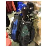 Pair of golf bags with assorted clubs local
