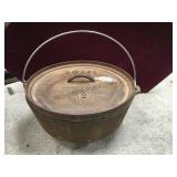 Lodge cast iron Dutch oven, # 12, footed local