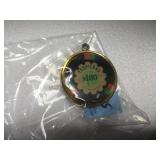 Tropicana $100 chip, set in a bezel , Collector