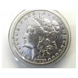 1880 Morgan silver dollar (a buck for