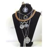 Neck w/ multiple necklaces & rings