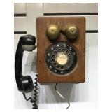 Vintage rotary wall phone.          
Local