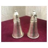 Pair of sterling weighted salt and pepper shakers