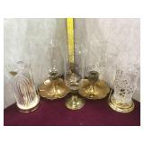 Lot of brass and glass candle holders and a pair