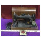 Vintage Singer portable sewing machine with case,
