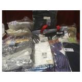 Lot of new and returned clothing in bags from