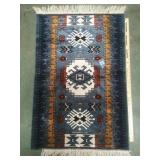 Southwest design tassel rug, some tassels