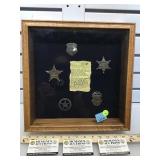 LE Tin Star Collection n an oak display case,