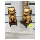 Pr carved Foo Dogs, on stands, resin