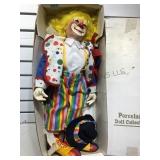 24 inch H. Porcelain clown doll, new in box,