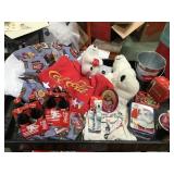 Coca-Cola items, bears, shirts, bedding, tins,