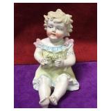 Vintage bisque piano baby, crack found on neck.