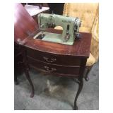 Vintage sewing machine in cabinet, Adler, false