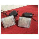 A pair of Hammacher Schlemmer television