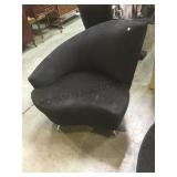 Chair,asymmetrical, chrome legs, modern design,