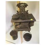 Royal toy cast iron stove w/ pans, antique