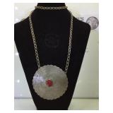 Large coin silver medallion on chain w/ red
