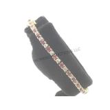 14k glold tennis bracelet w/red & clear gemstones