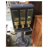 3 place 25 cent coin op dispenser , on stand,