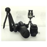Nikon D3100 camera with lenses and tripods.