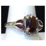 Sterling silver ring with garnet 
Size 8