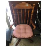 Rolling wood armchair