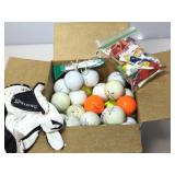 Box of golf items. Balls, glove, tees and more.