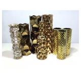 8 assorted gold colored vases.