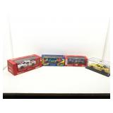 4 die cast model cars in boxes.