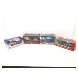 4 die cast model cars in original boxes.