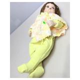 Vintage 22in doll with knitted sweater and Winnie