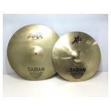 2 large Sabian cymbals.