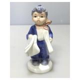 Napco Ceramic Figurine. Newsboy. 6in. H