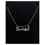 Sterling silver necklace with "bombshell" pendant