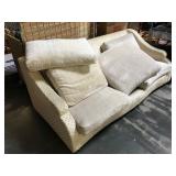 Couch with unmatched cushions from high end hotel