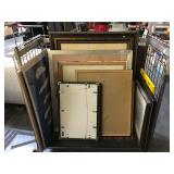 Cart full of assorted framed prints and more