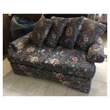 Floral print loveseat with rips