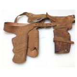 2 vintage child sizes holster belts. One is