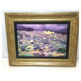 Signed enhanced print with desert landscape.