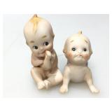 2 porcelain Kewpee dolls.