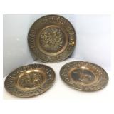 3 repousse plates. Made in Holland. Largest is