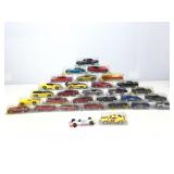 Assorted die cast cars in plastic cases.