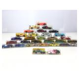 Assorted die cast cars in plastic cases.