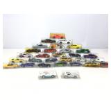 Assorted die cast cars in plastic cases.